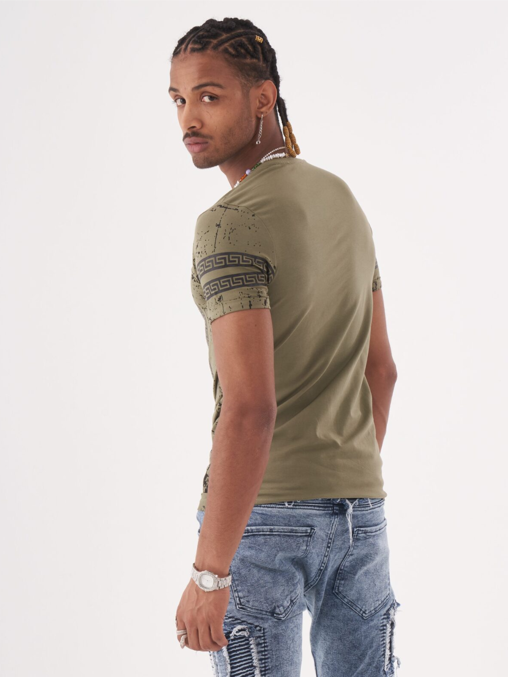 The rugged back of a man wearing an AFTERLIFE T-SHIRT and jeans.