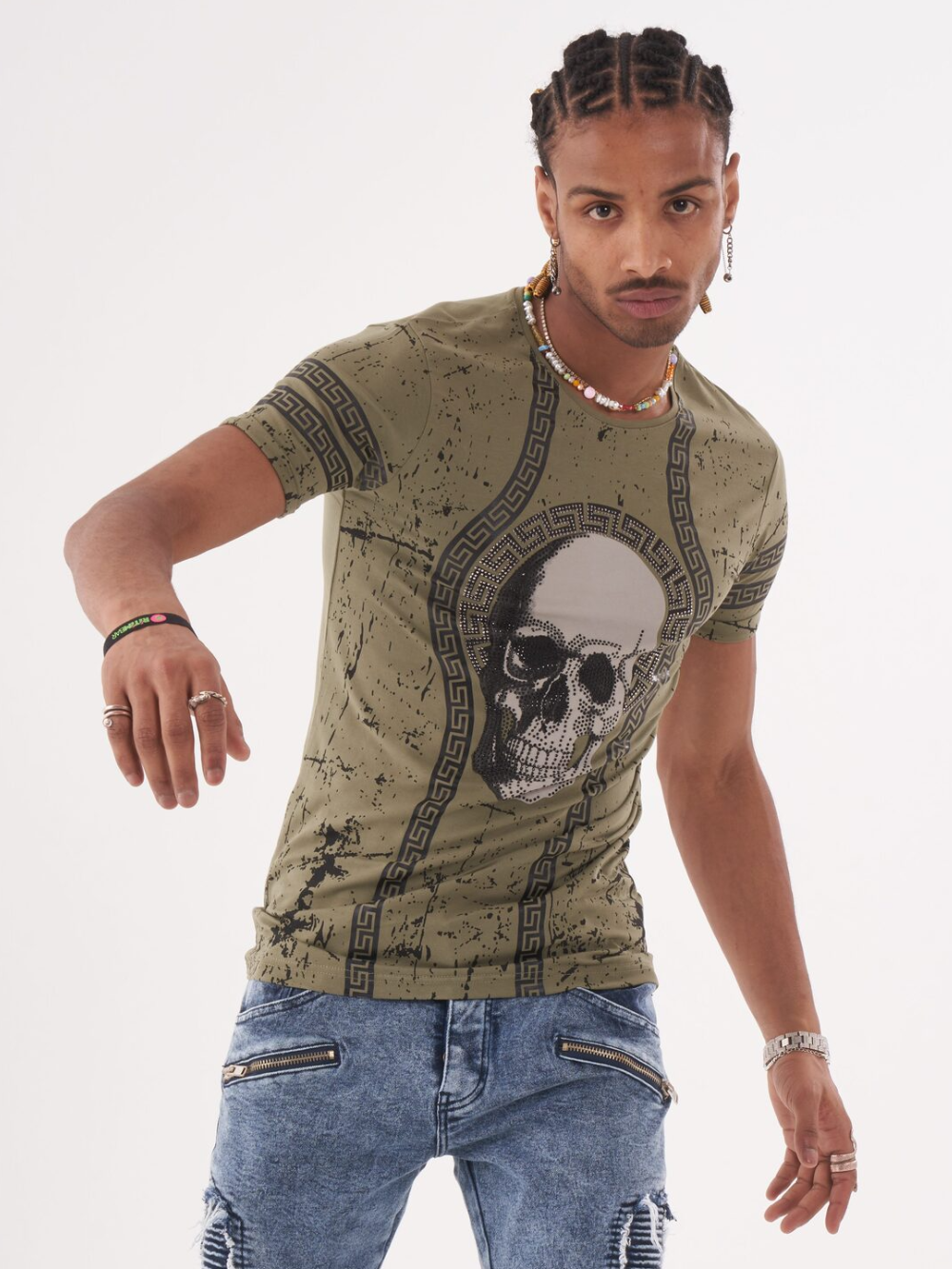 A rugged man wearing the AFTERLIFE T-SHIRT with a skull on it.