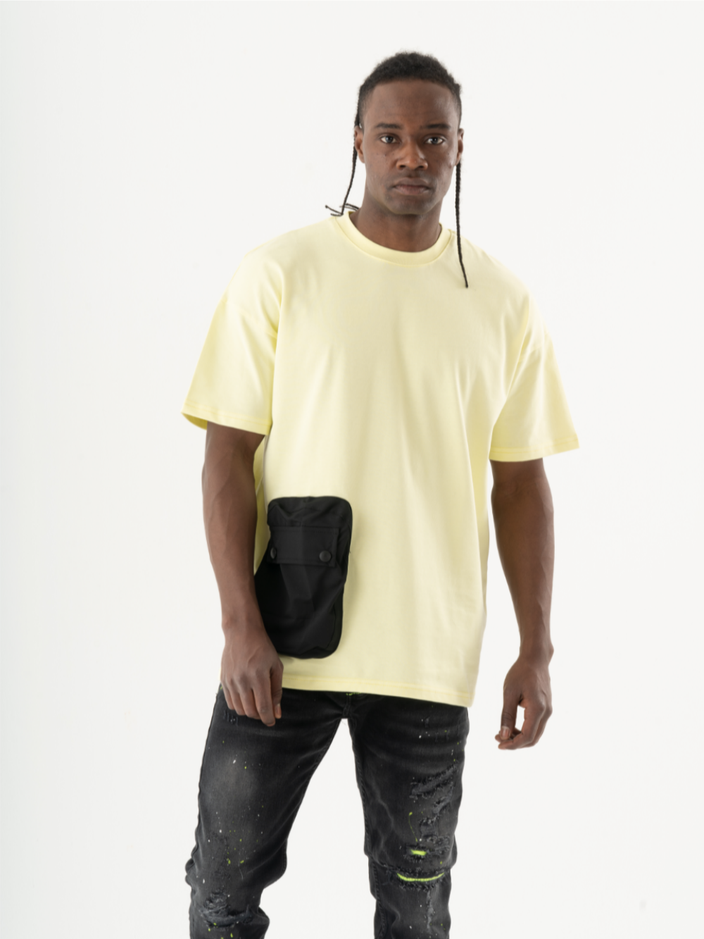 A man displaying a casual look with a SUNRAY T-SHIRT featuring a black pocket.