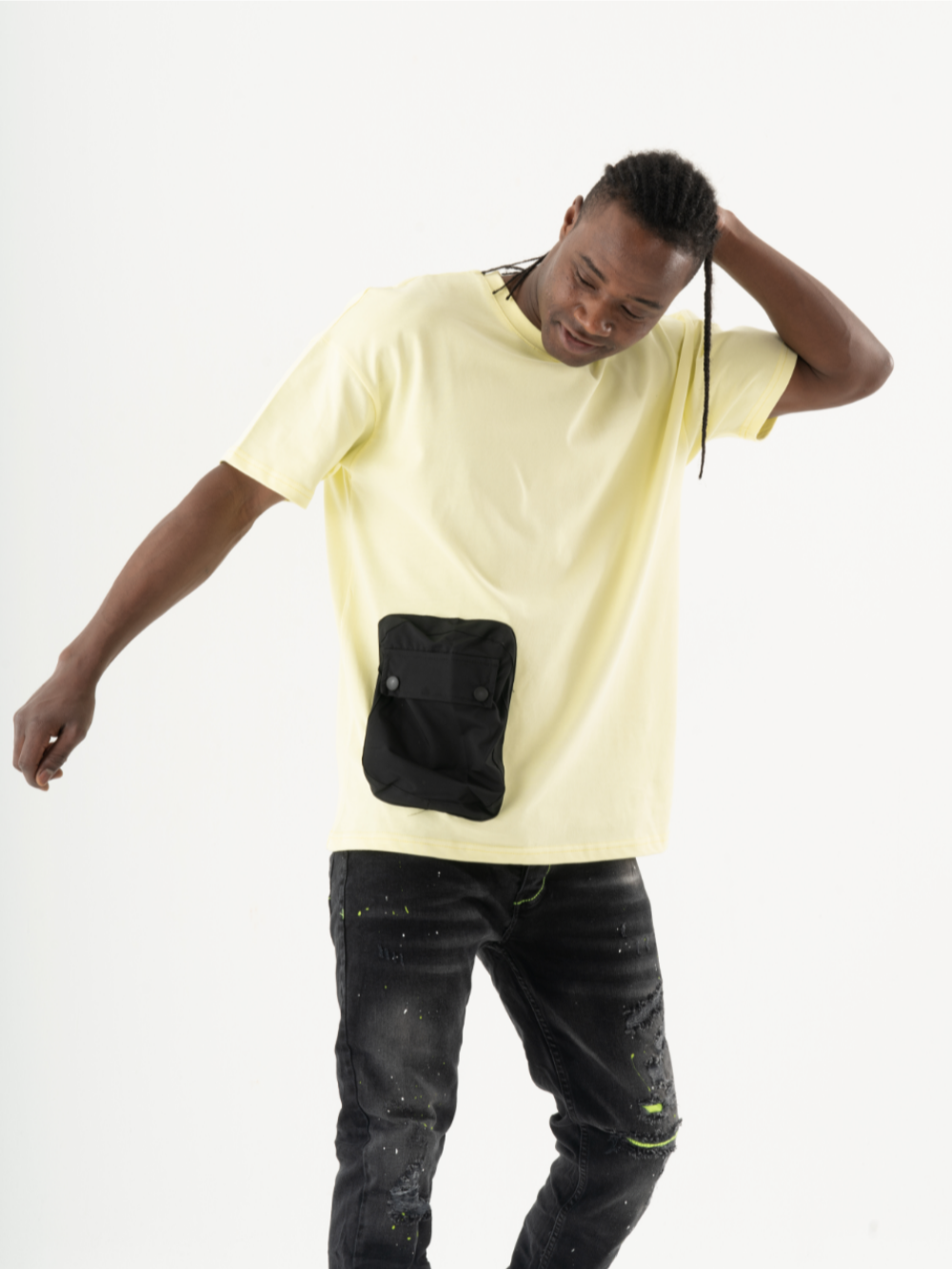 A man in a yellow Sunray T-shirt with a black pocket.