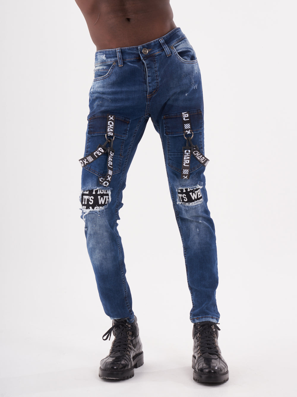 A man in TORNADO BLUE jeans posing for a photo.