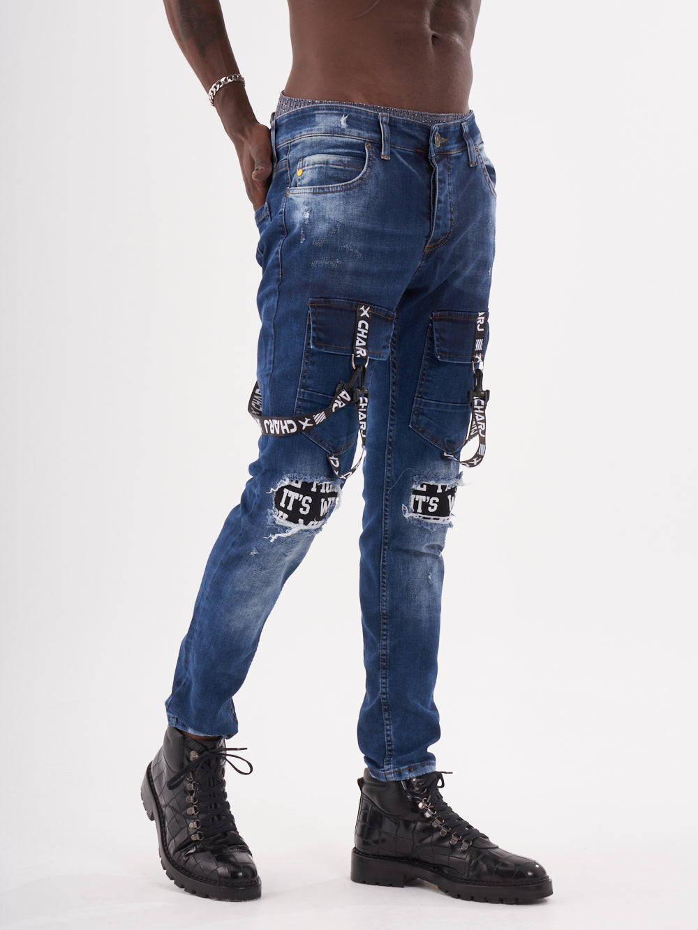 A man in TORNADO BLUE posing in front of a white background.