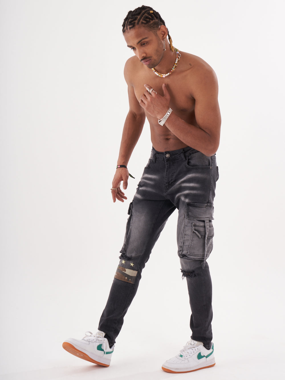 A man wearing a pair of HIPSTER jeans and a white t-shirt.