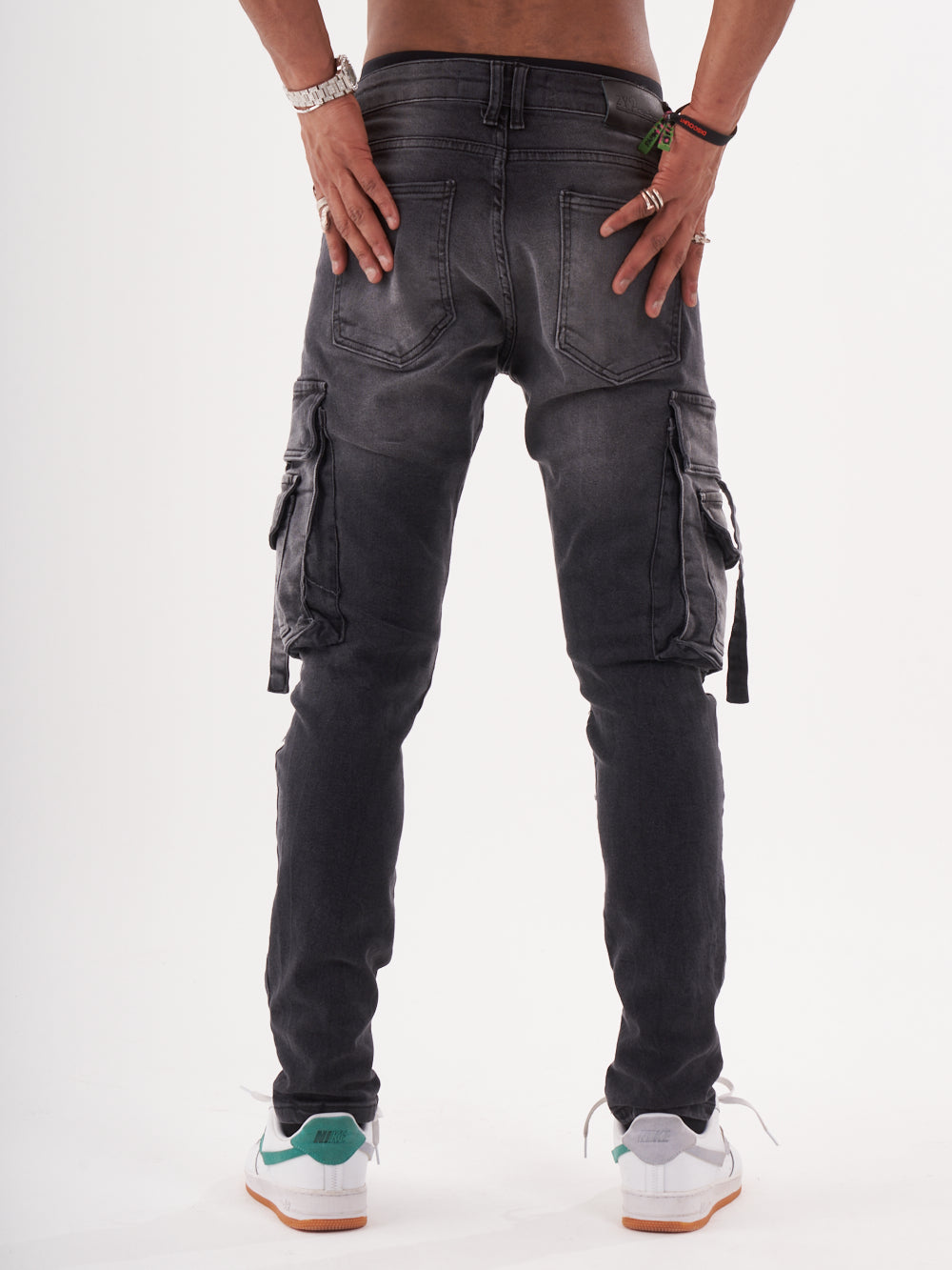 The back view of a man wearing HIPSTER jeans.