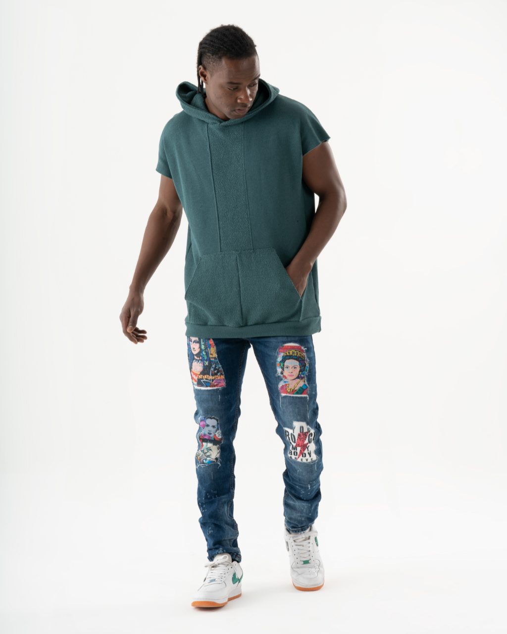 A man wearing jeans and a CRESCENDO hoodie.