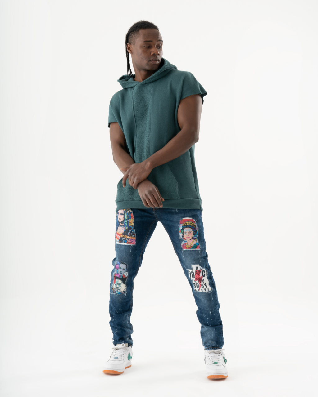 A man wearing a green hoodie and jeans attends a CRESCENDO concert.