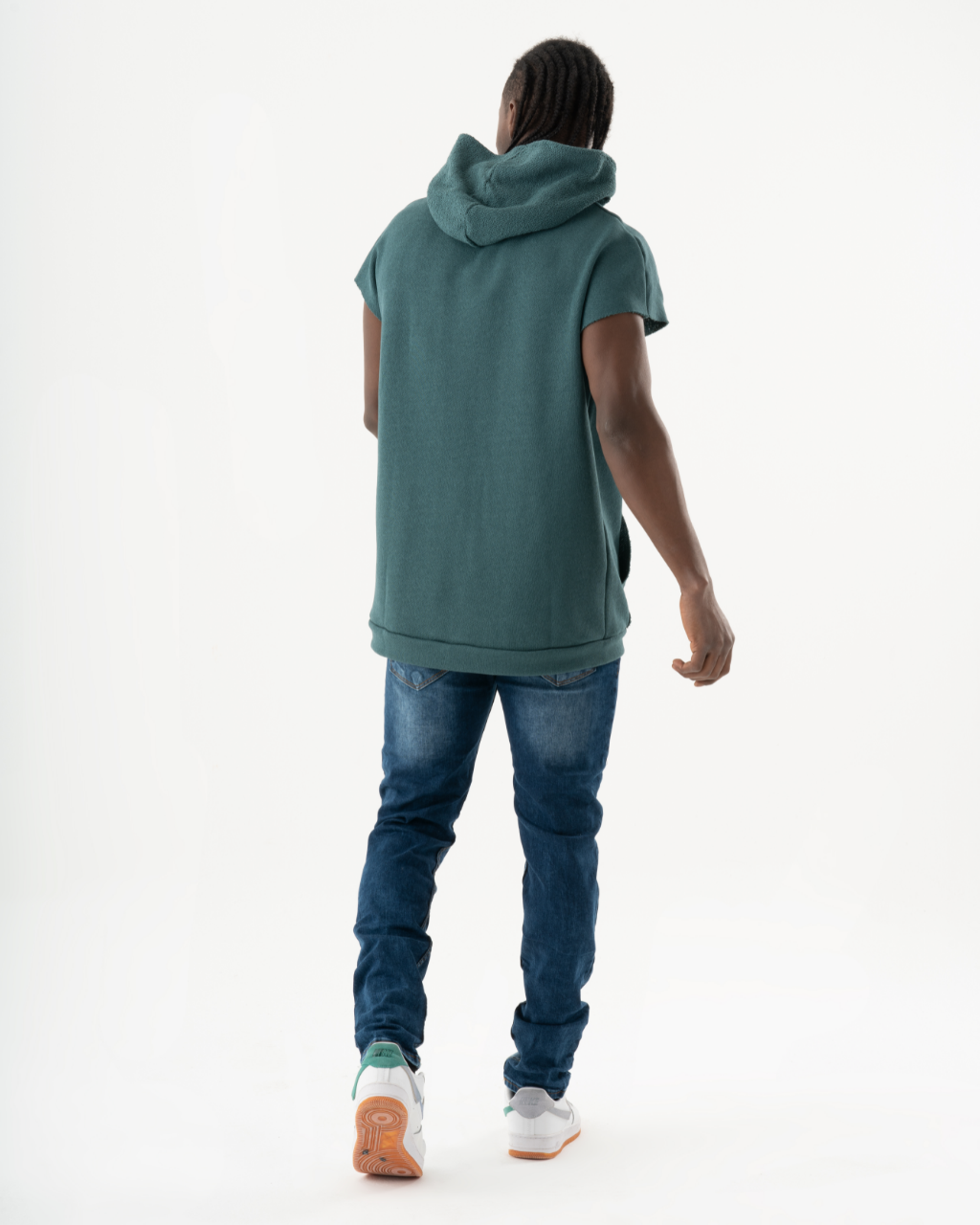 The back of a man wearing CRESCENDO jeans.