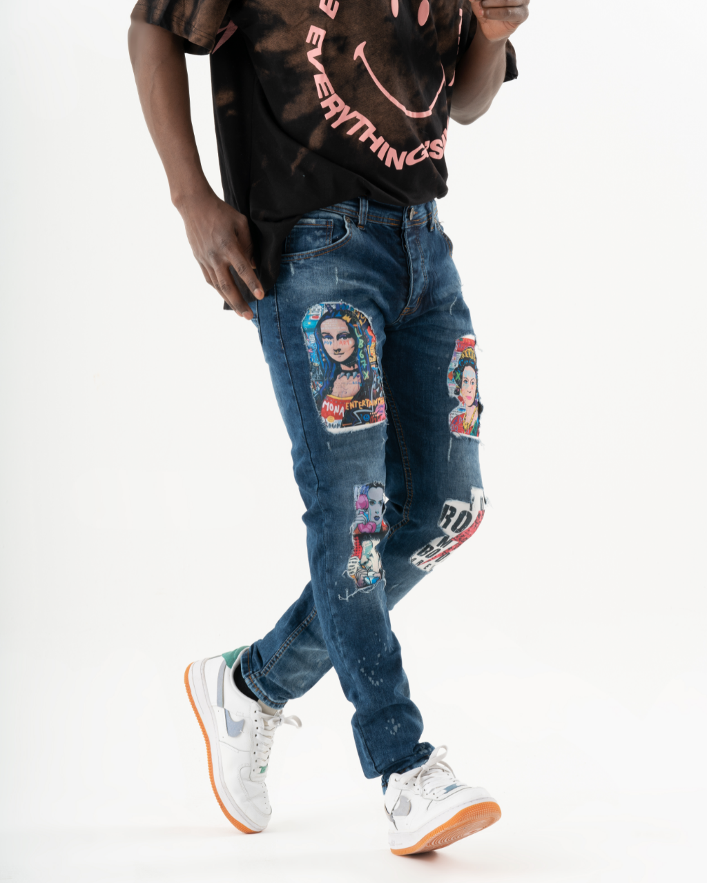 A person wearing CRESCENDO with patches on them at a concert.