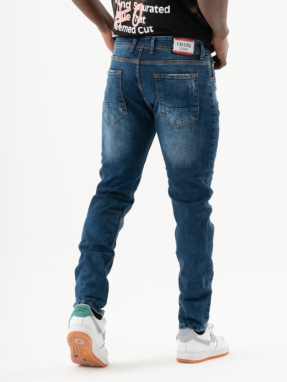 The back of a man wearing CRESCENDO at a concert.