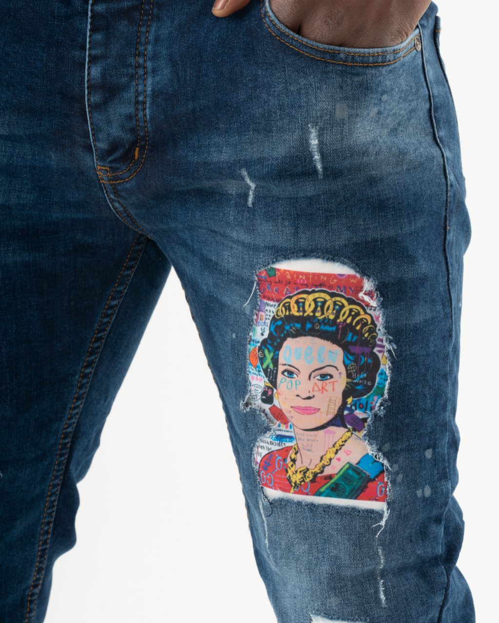 A pair of CRESCENDO jeans featuring an image of Queen Elizabeth.