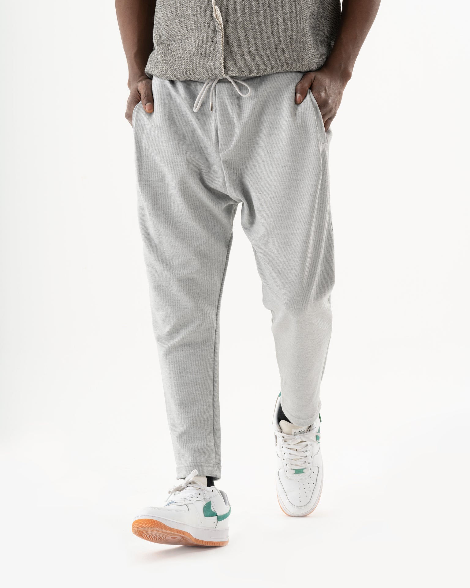 A man in SERENE JOGGERS is standing on a white background.
