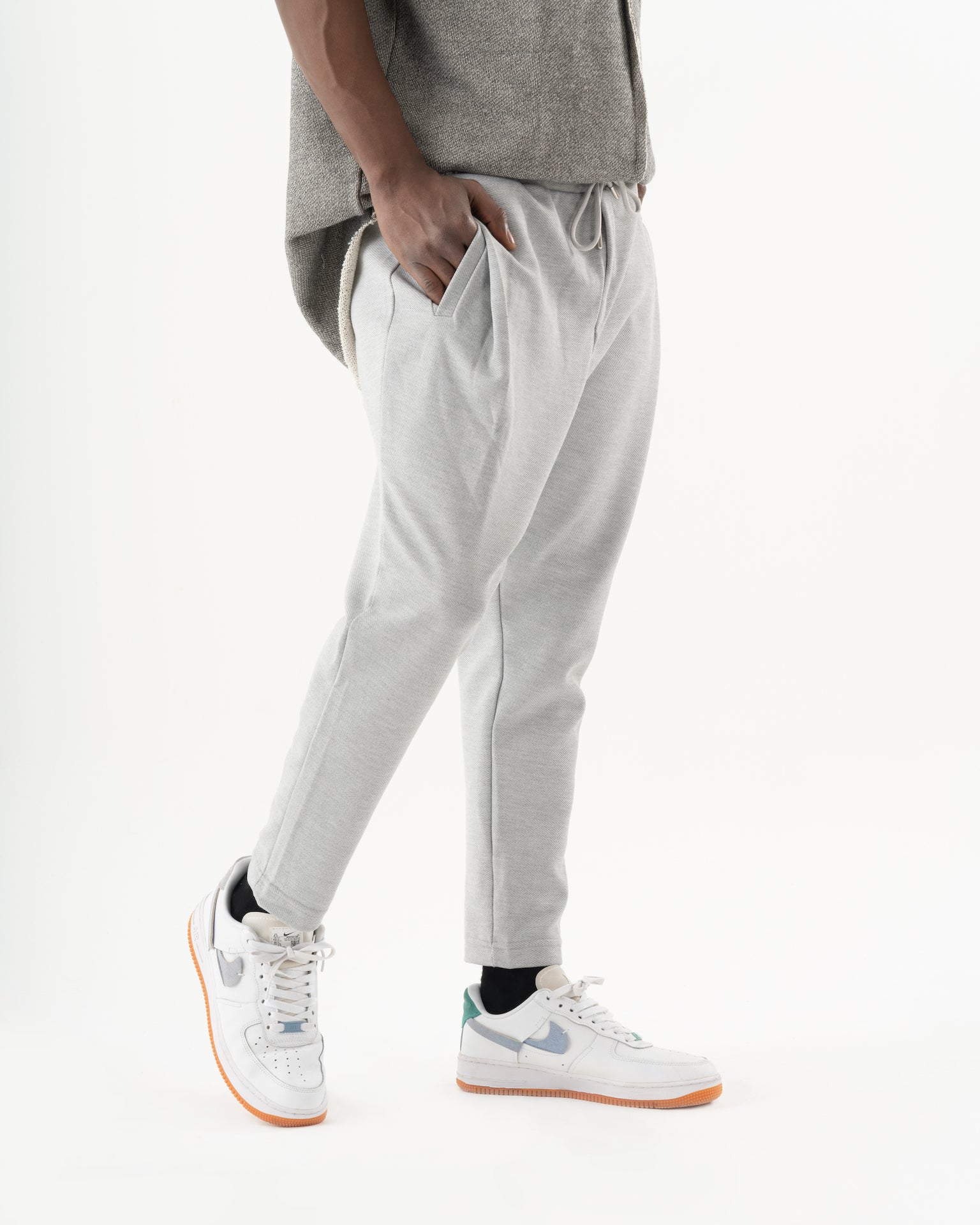 A man donning cozy SERENE JOGGERS and comfortable sneakers in his everyday wear.