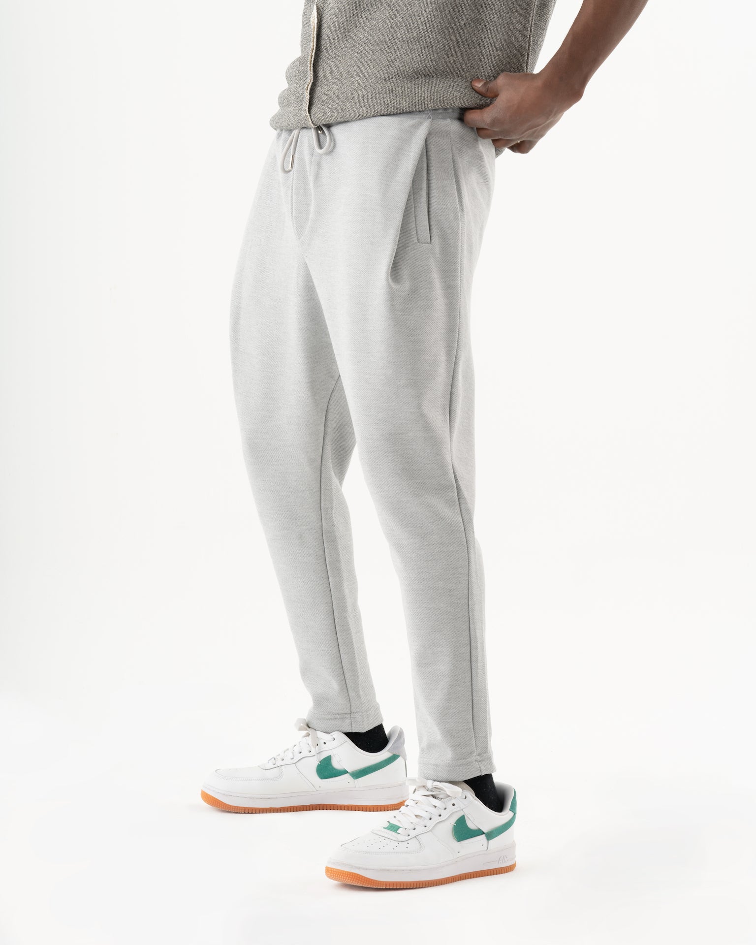A man in comfortable SERENE joggers is posing for a photo.