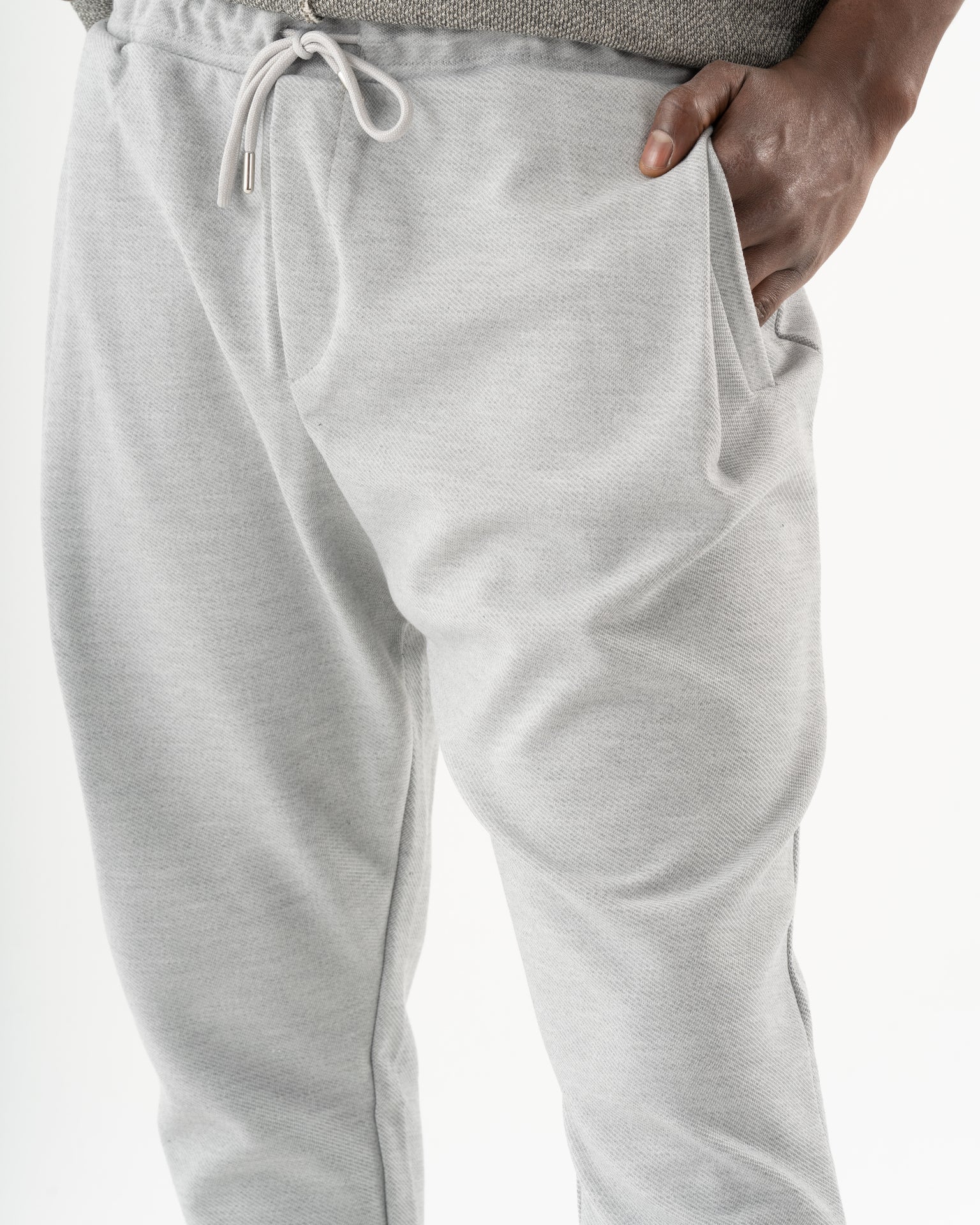 A man wearing SERENE JOGGERS, ideal for everyday wear or as joggers.
