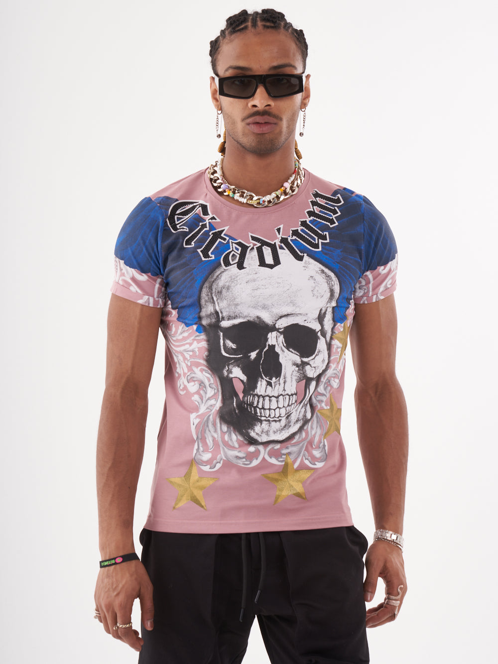 A man wearing a EUPHORIA T-SHIRT | MAUVE with a skeleton print.