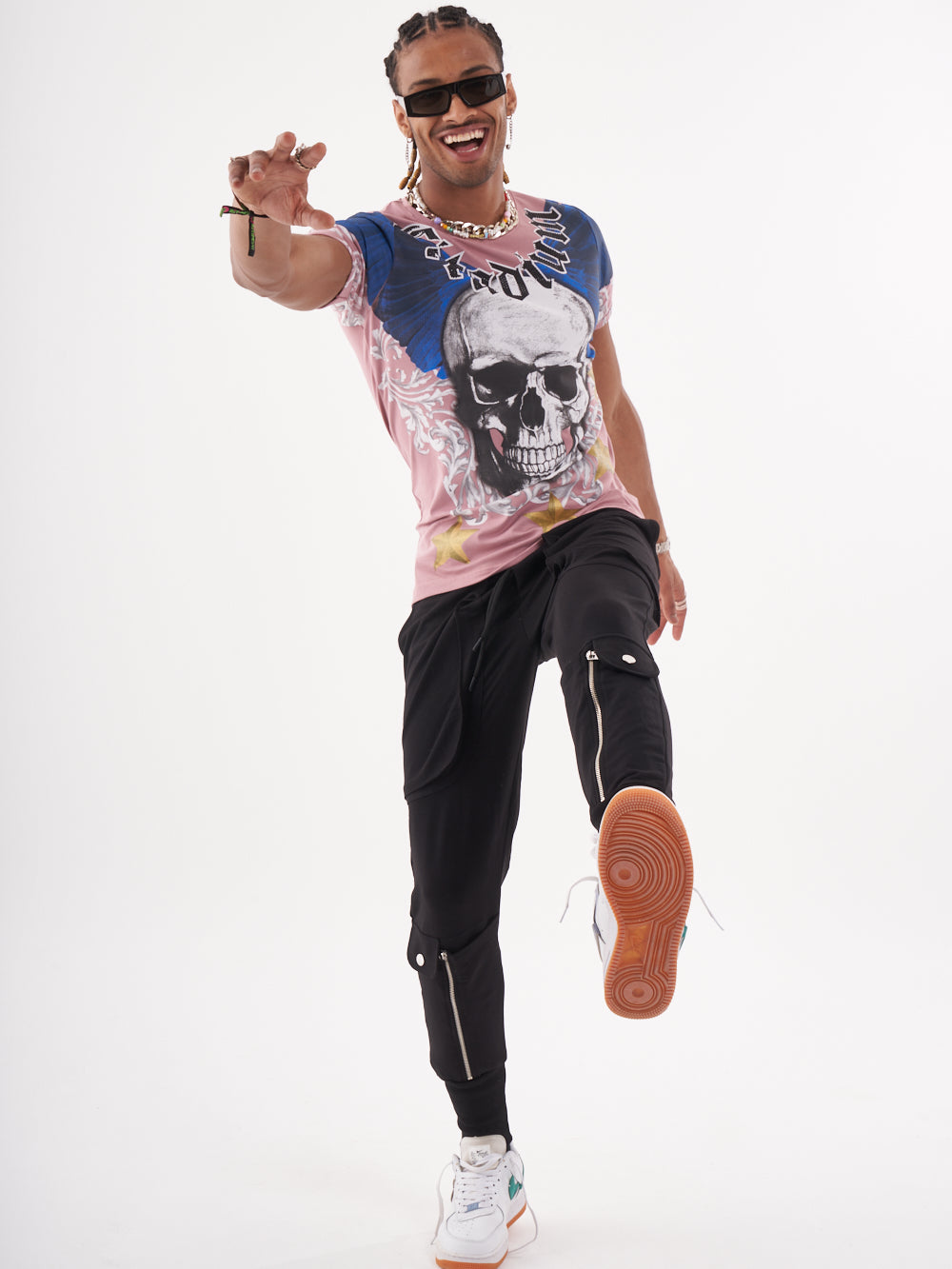 A man wearing a EUPHORIA T-SHIRT | MAUVE with a skeleton print on it.