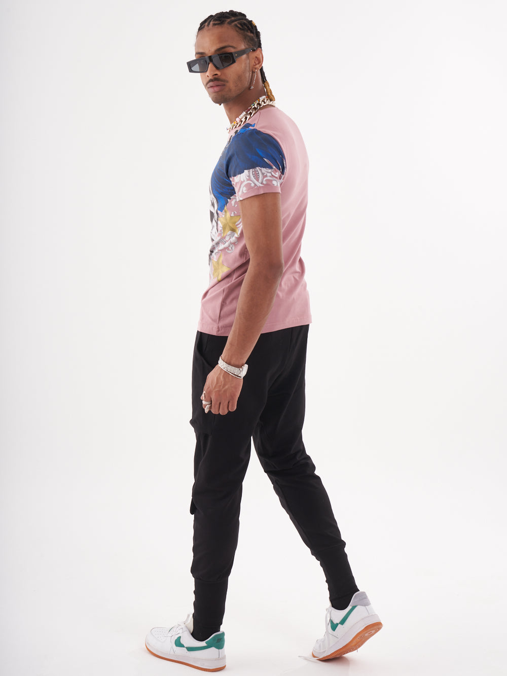 A man wearing a EUPHORIA T-SHIRT | MAUVE with a skeleton print.