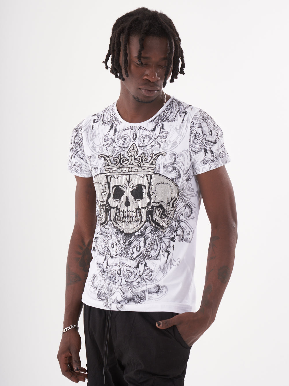 A man wearing an edgy, gothic-inspired Trinity T-shirt, showcasing his fashion game.
