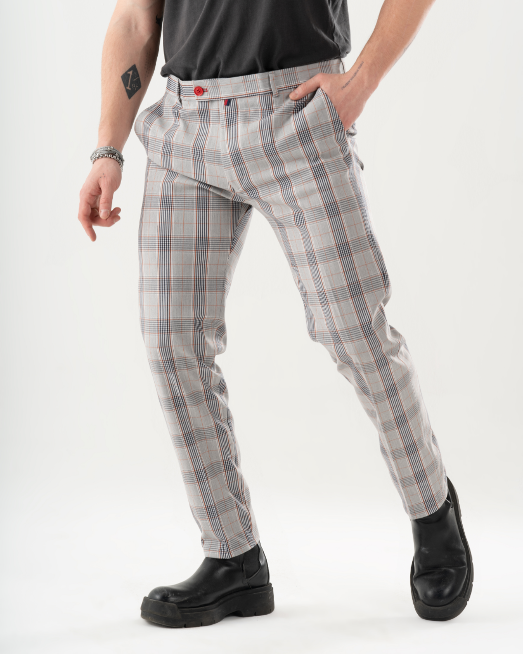 A man in KIKR PANTS is posing.