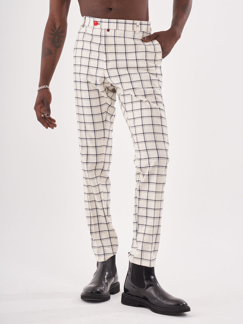 A man wearing TIMONO PANTS.