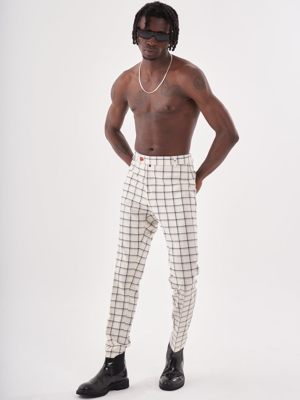 A man wearing TIMONO PANTS.