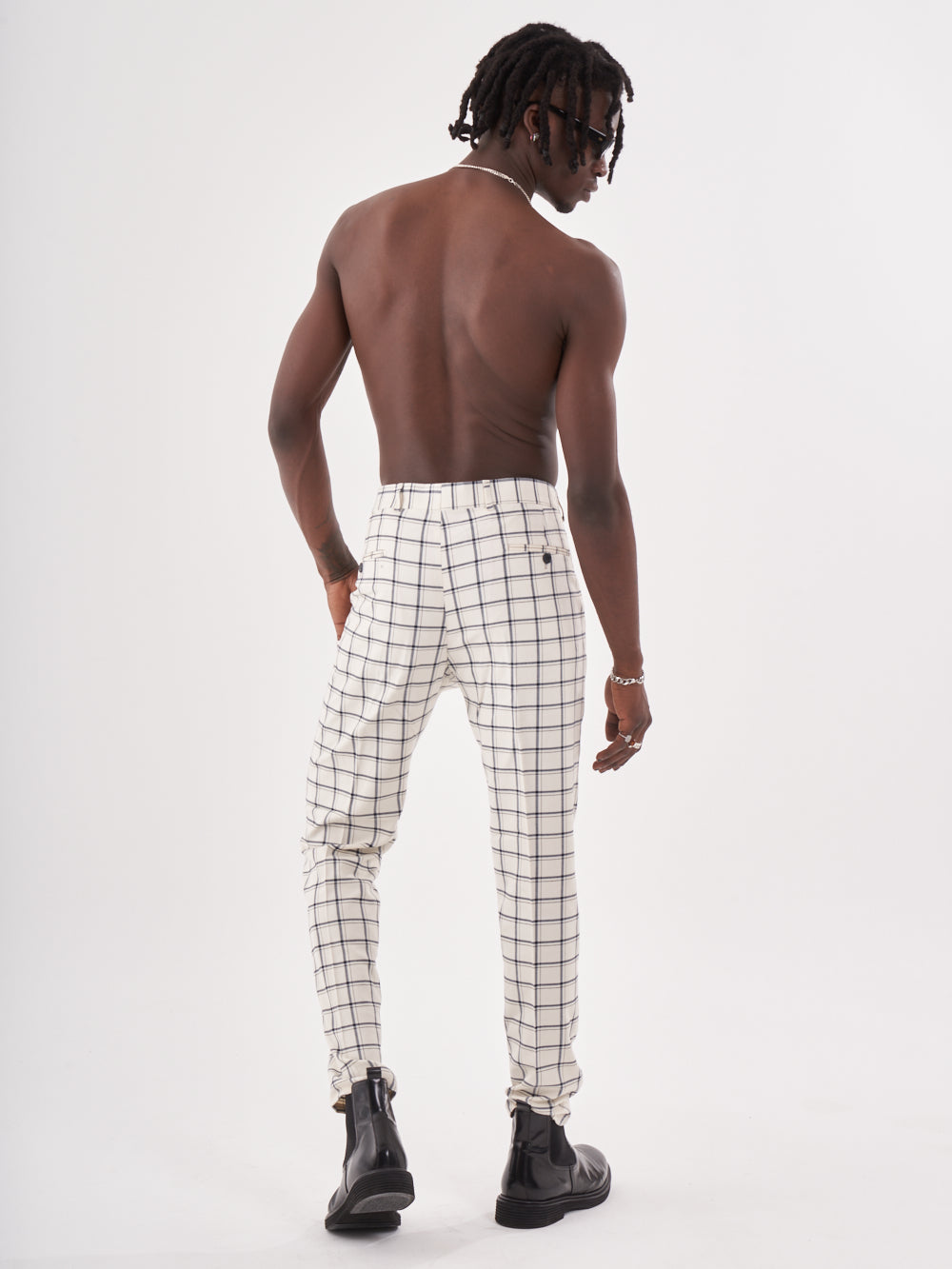 The back of a man wearing TIMONO PANTS.