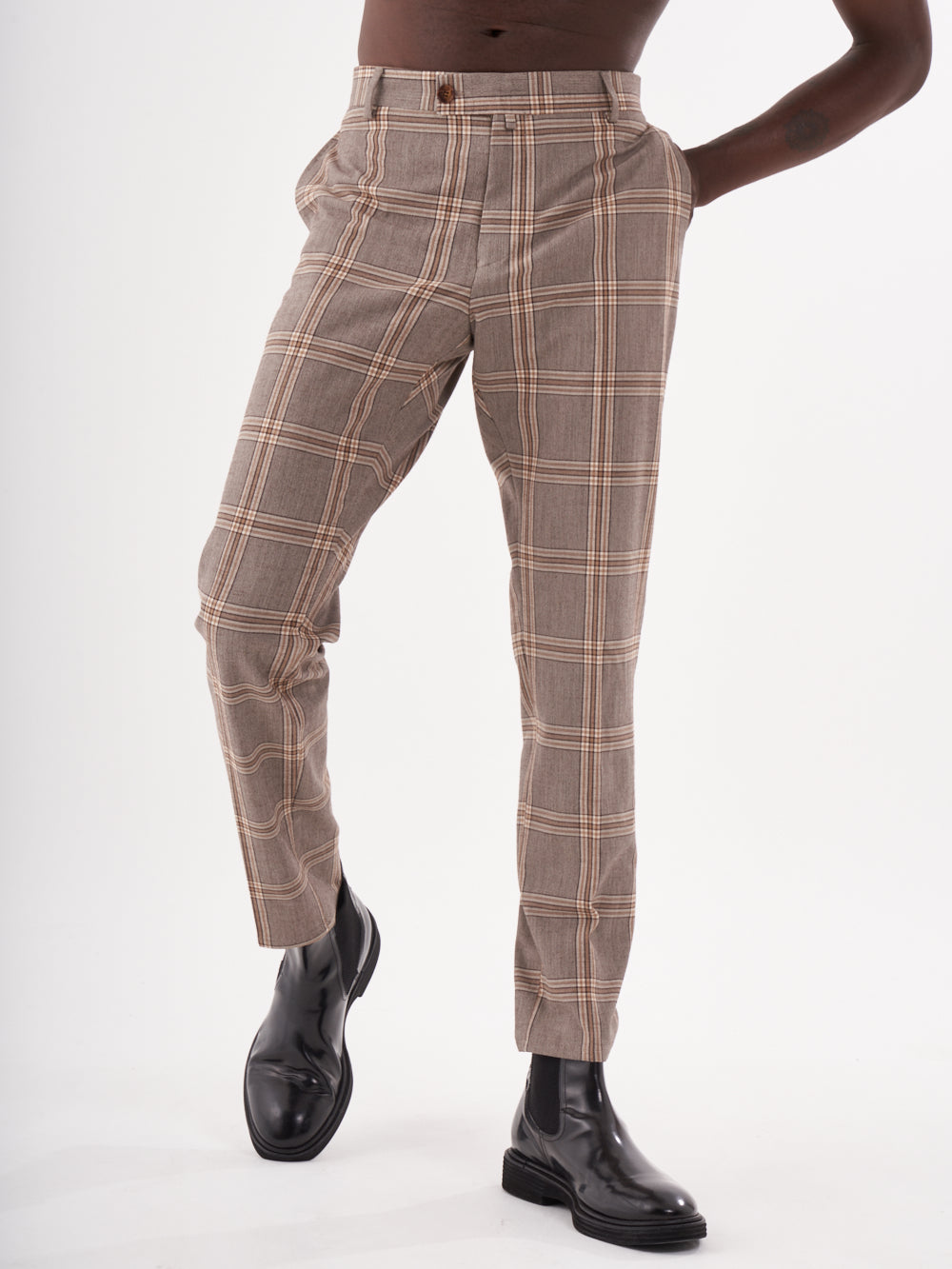 A man in ROOK pants posing in front of a white background.