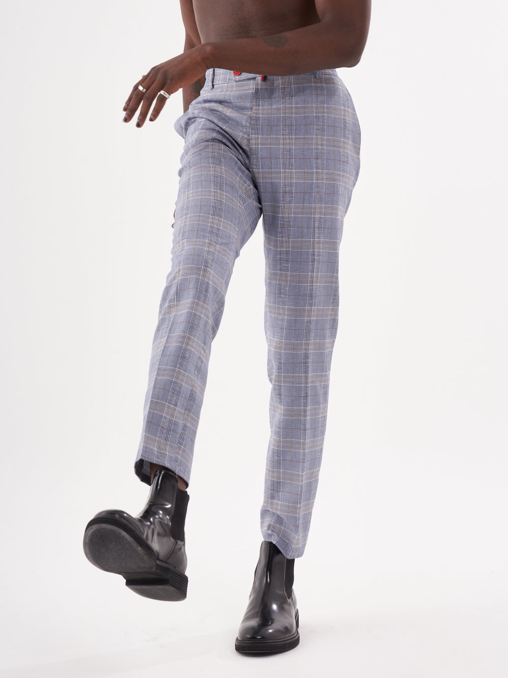 A man in a white shirt and Moraine pants is standing on a white background.