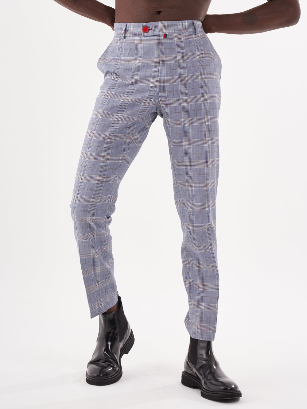 A man wearing Moraine pants, a blue and white checkered suit.