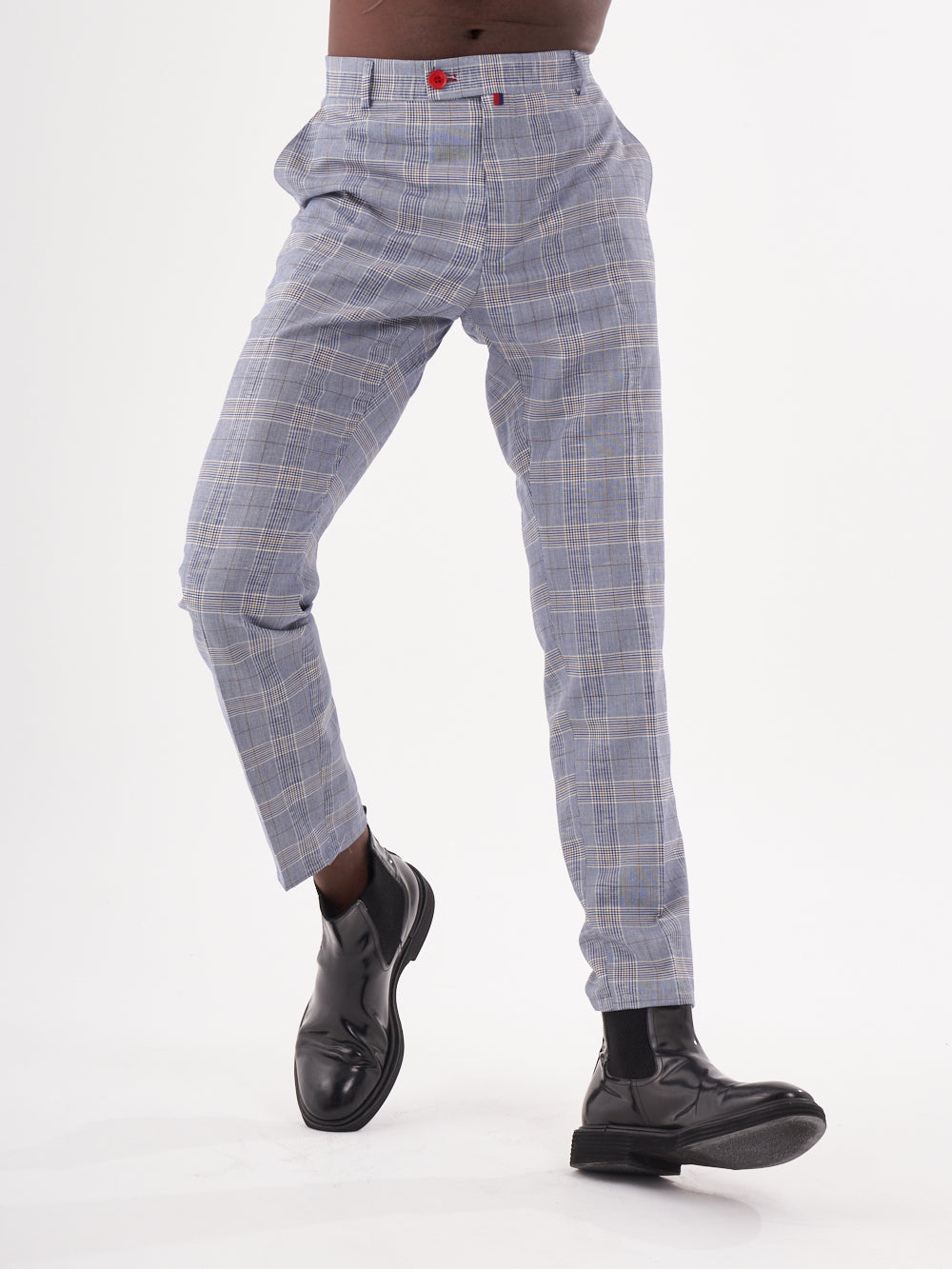 A man in MORAINE PANTS is posing on a white background.