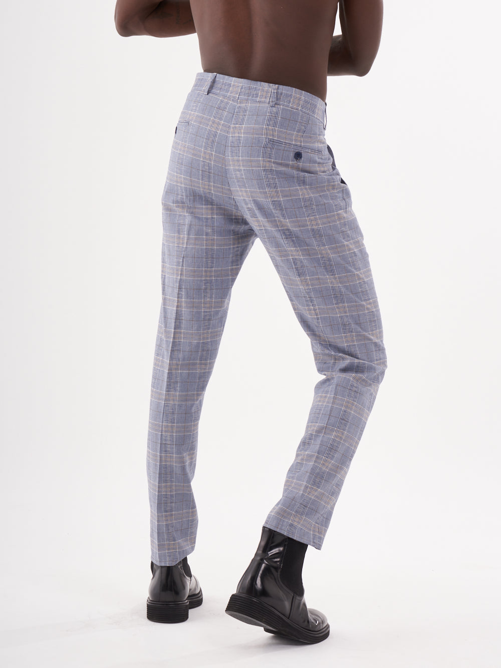 A man is standing with his back to the camera in Moraine pants.