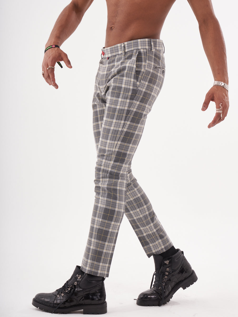 A man with no shirt and CHECKMATE PANTS is standing on a white background.