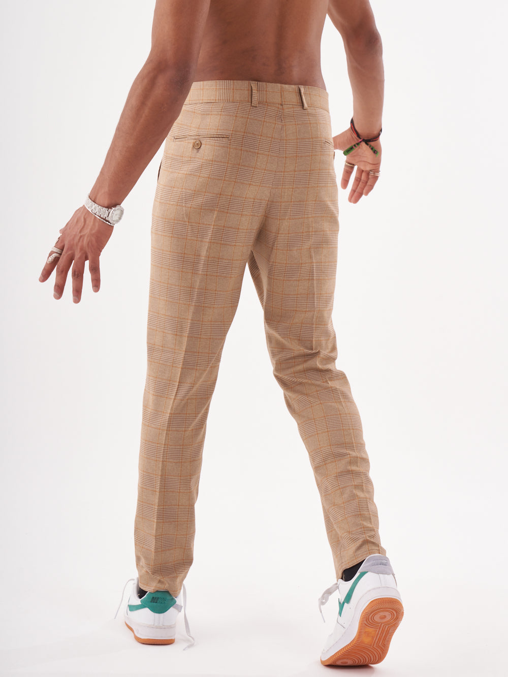 A man wearing a BAROT suit pants.