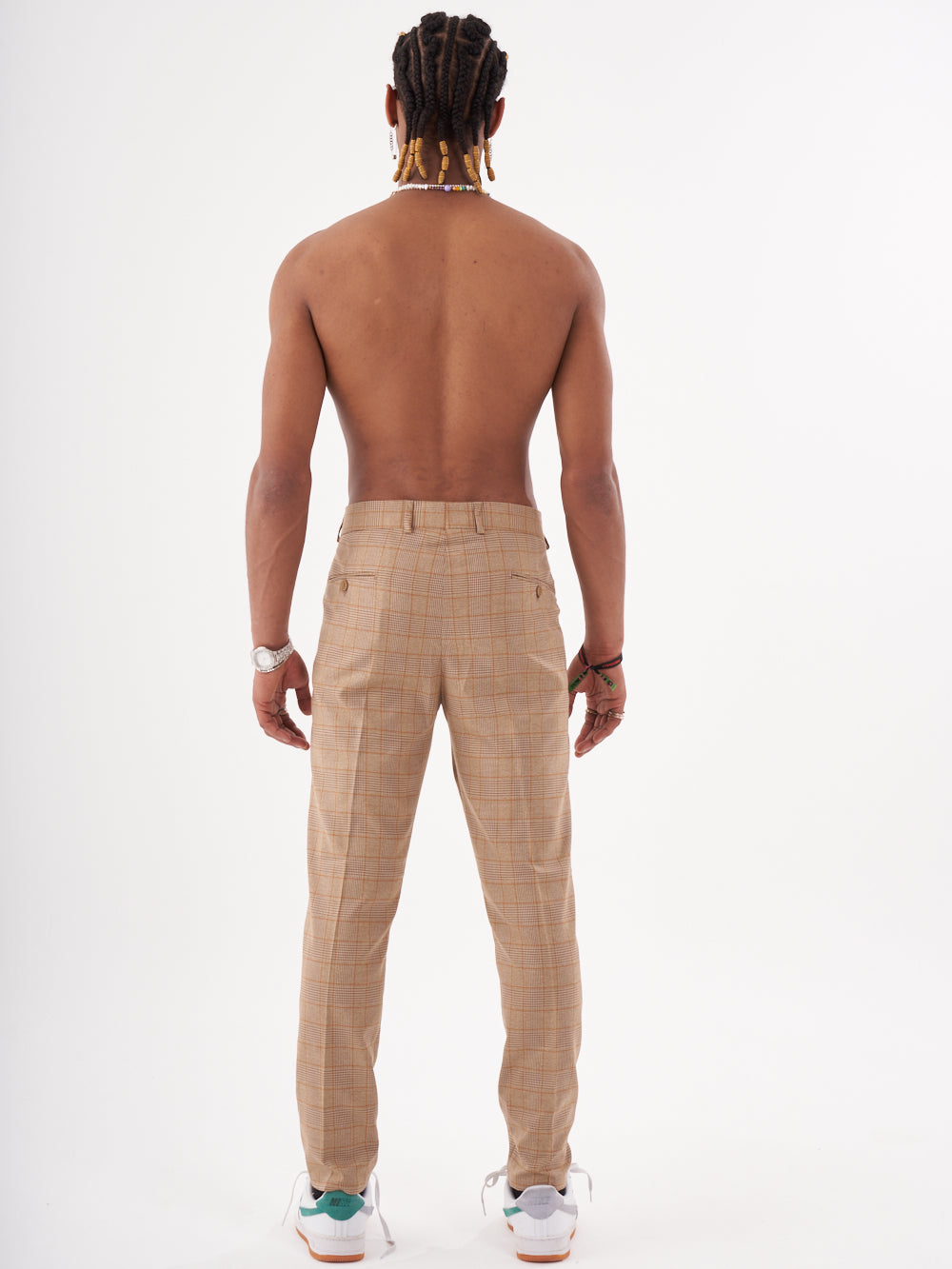 The back view of a man wearing Barot pants.