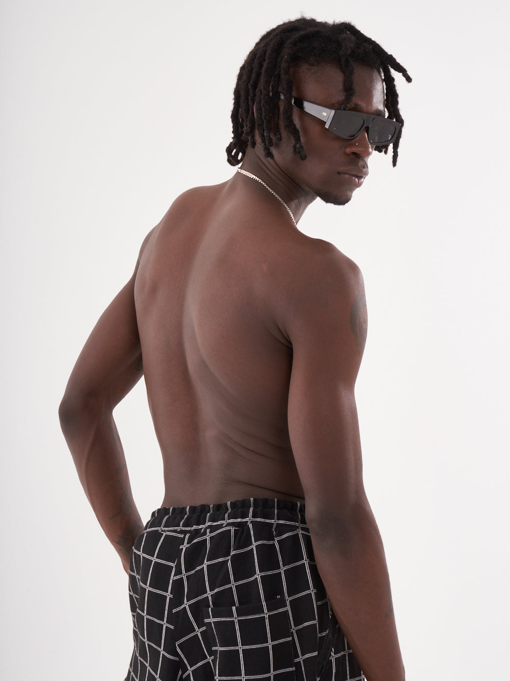 The back of a man wearing WACKADOO JOGGERS.