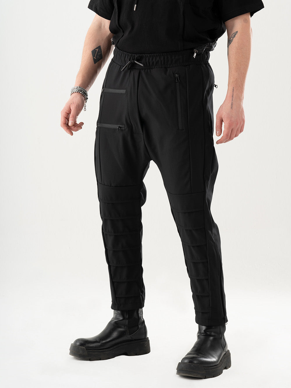 A man wearing INVOGUE JOGGERS and a black t - shirt.