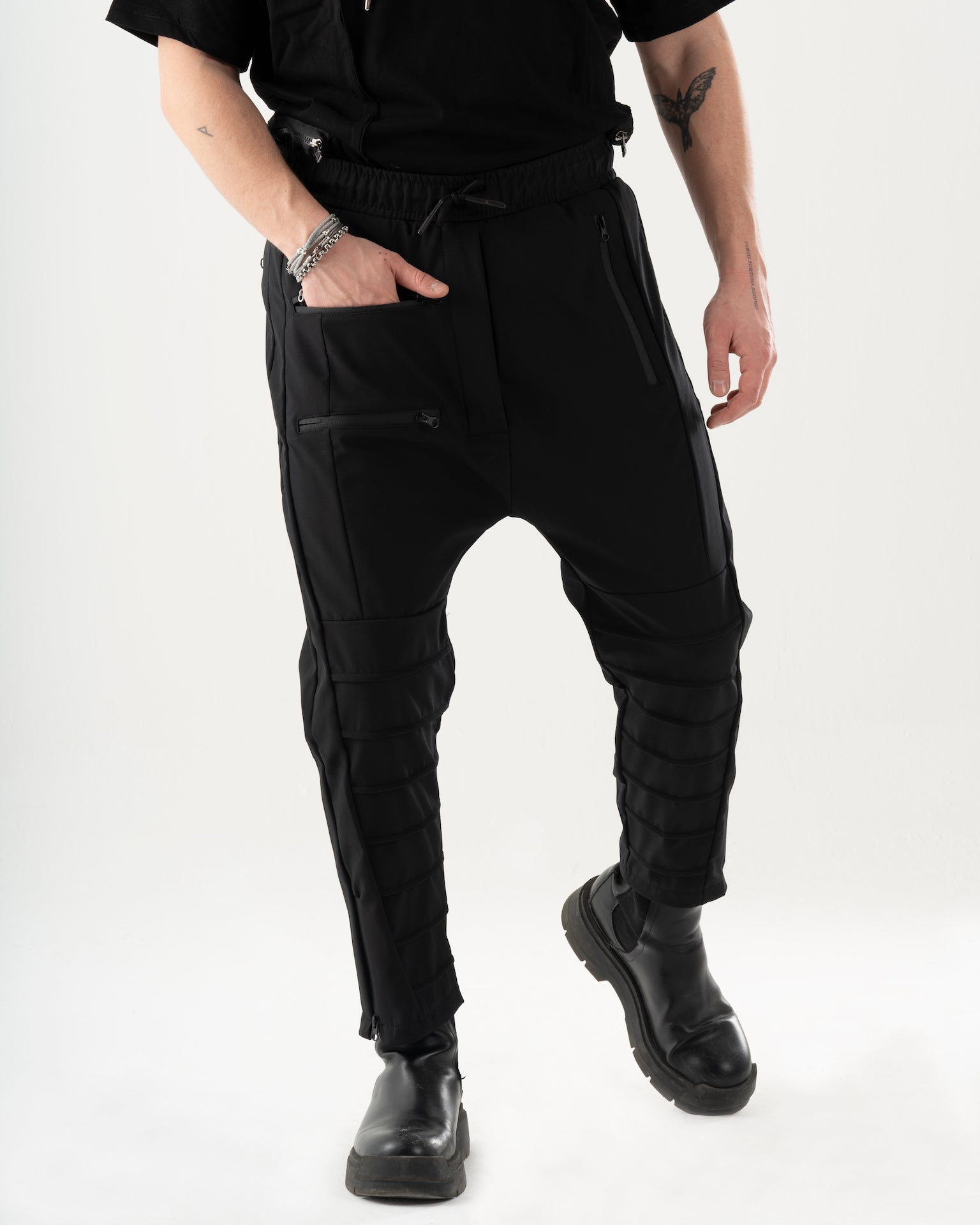 A man wearing INVOGUE JOGGERS and a black t - shirt.