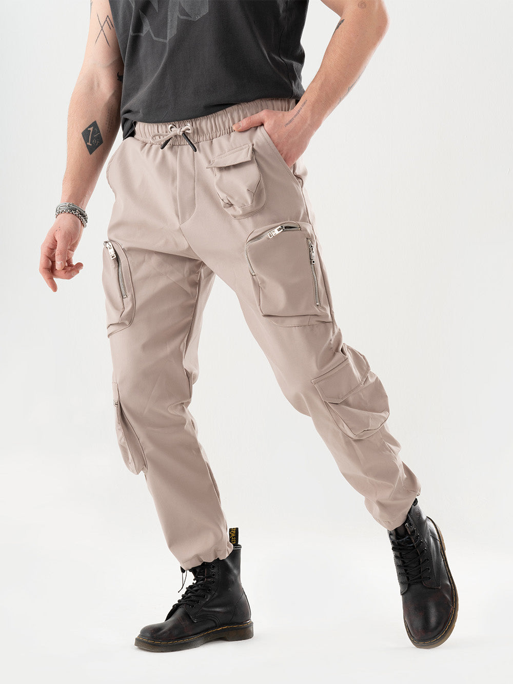 An AMBITION JOGGER wearing comfortable cargo pants with a black t-shirt, combining style and function.