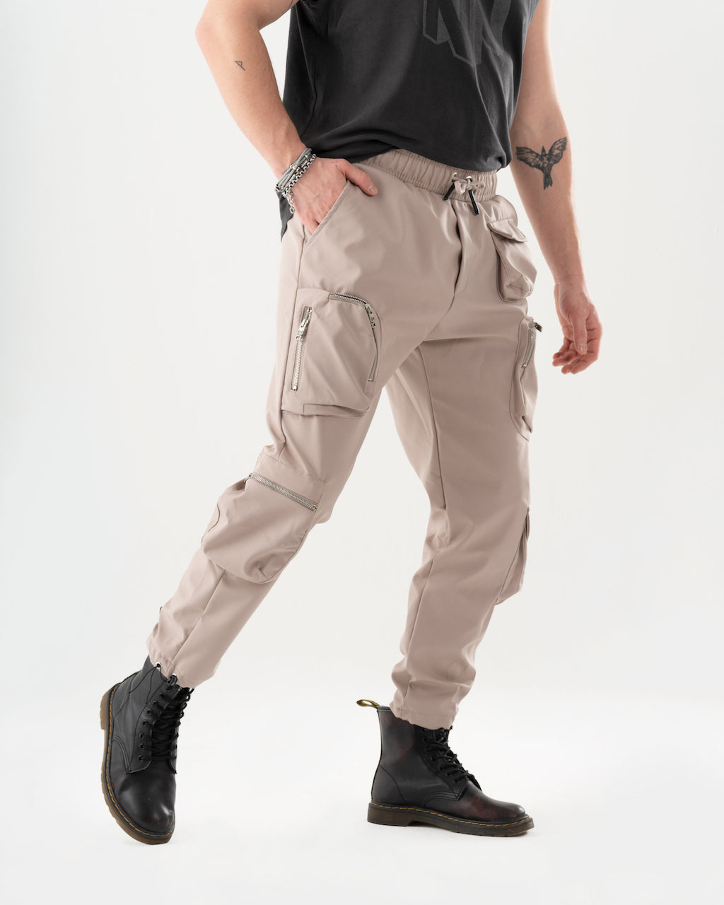 A comfortable man, dressed in a t-shirt and AMBITION JOGGERS, exudes style and function.