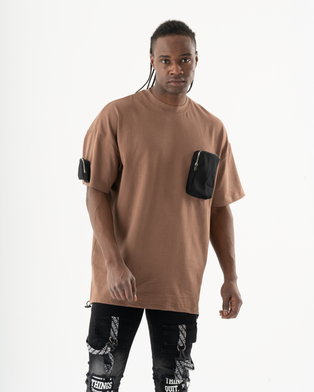 A man wearing a FATE t-shirt and black jeans.