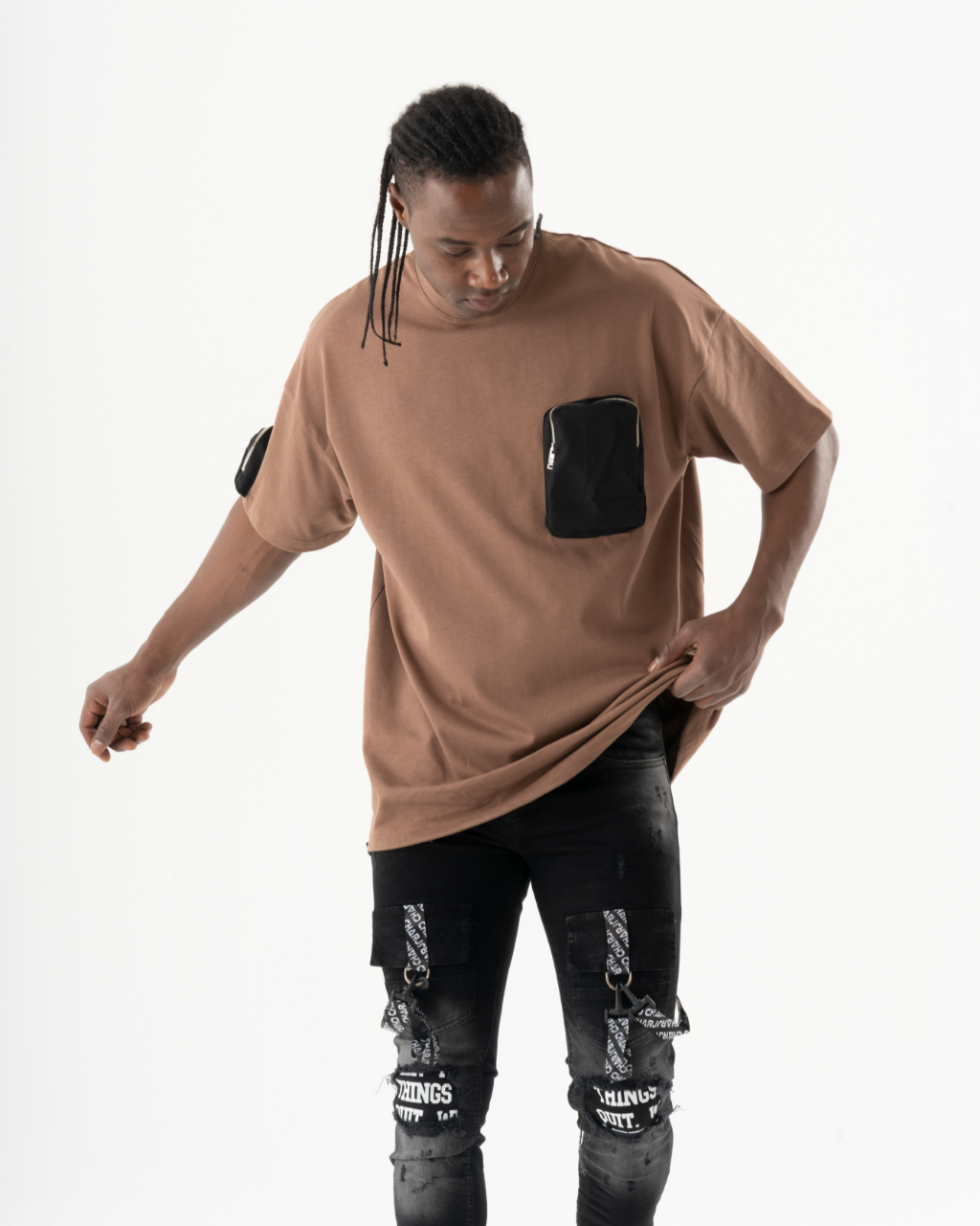 A man wearing a FATE t-shirt and black jeans.