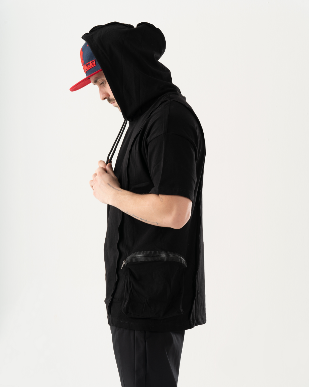 A stylish man wearing a BLACKFURY HOODIE