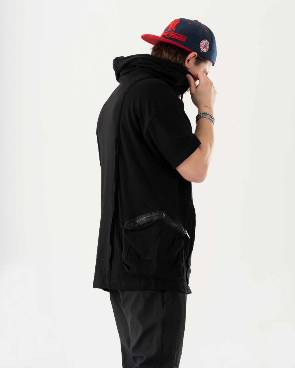 A man wearing a stylish BLACKFURY HOODIE.
