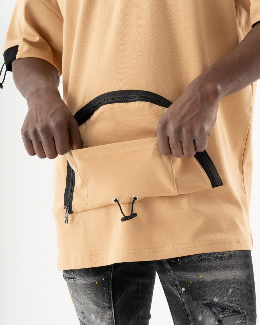 A man wearing a MOSCO t-shirt with a zipper pocket.