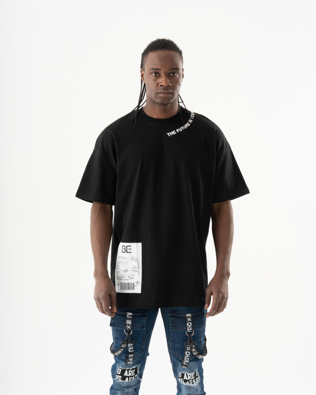 A man wearing a relaxed TURRET T-SHIRT and jeans.