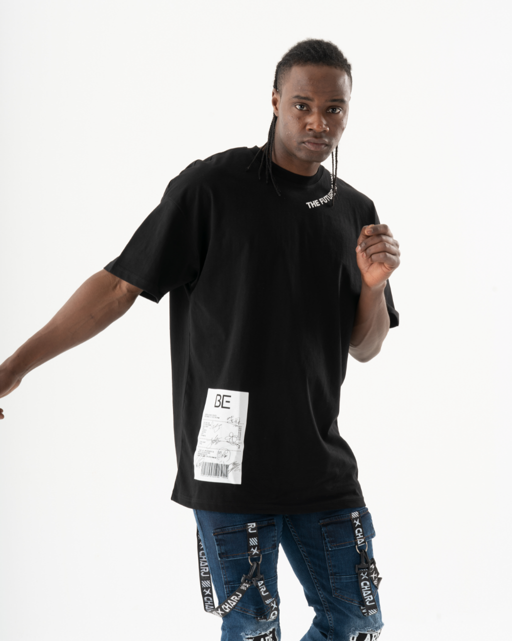 A man wearing a relaxed TURRET T-SHIRT.