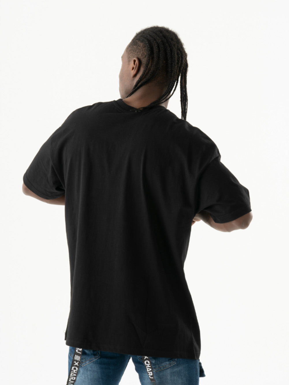 The relaxed back of a man wearing a comfortable TURRET T-SHIRT.