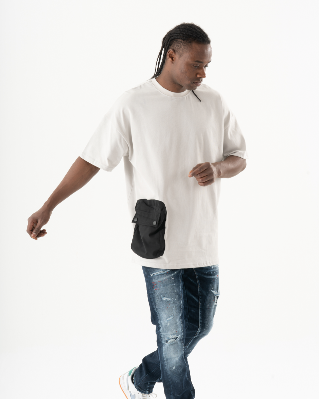 A man in an ELEVATE T-SHIRT with a black pocket.