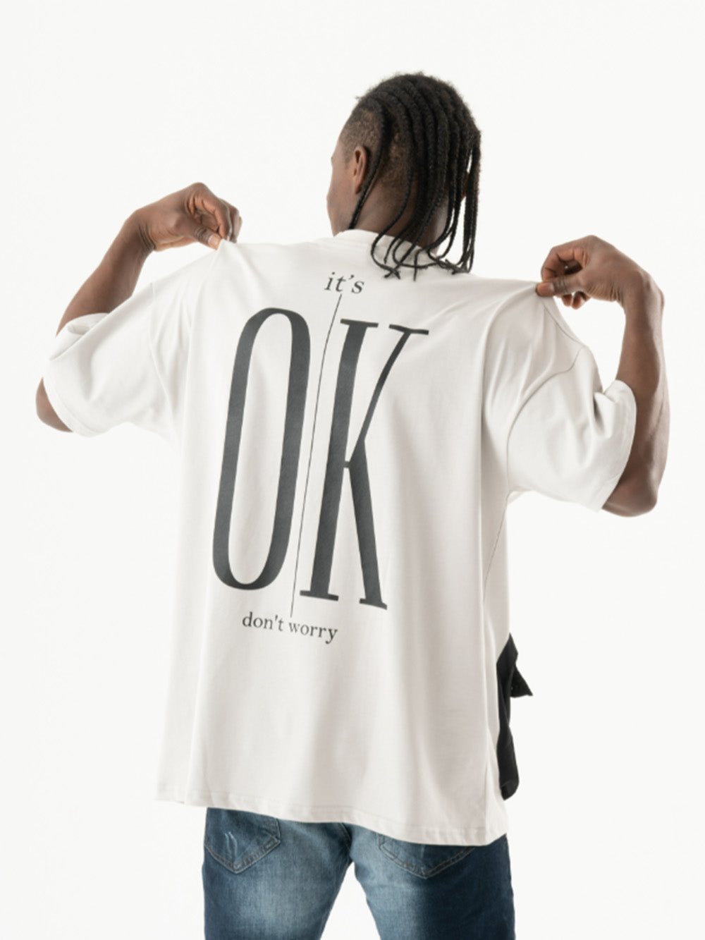 A man wearing an ELEVATE t-shirt with the word ok on it.