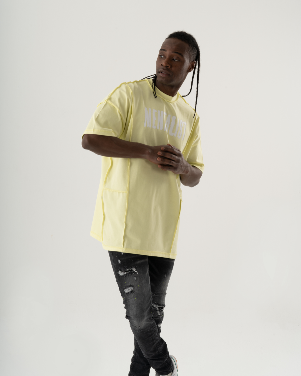 A summery man in a MENTALIST T-SHIRT | LIME posing in front of a white background.